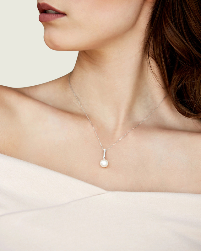 Model is wearing Dangling Diamond Pendant with 8.5-9.0mm AAAA quality pearls